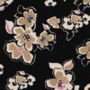 Tissu french terry noir avec grandes fleurs stylisées beige, crème et touches de rose, motif élégant et contrasté.