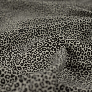 Tissu jersey de coton motif mini léopard noir sur fond kaki sauge