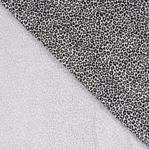 Tissu jersey de coton motif mini léopard noir sur fond écru