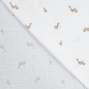 mousseline de coton écrue avec petits dinosaures brun sable motif enfant